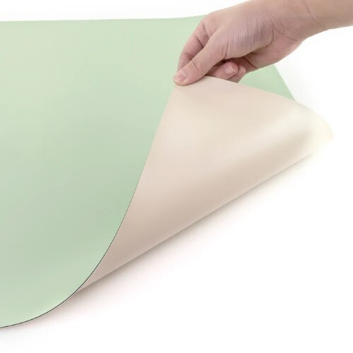 Green and ivory drawing board cover on drafting surface